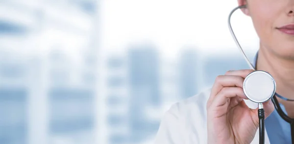 Female doctor holding stethoscope — Stock Photo, Image