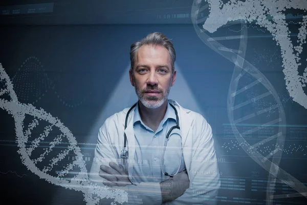 Male doctor standing against wall in corridor — Stock Photo, Image