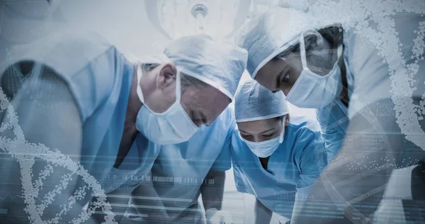 Surgeons performing operation in operation room — Stock Photo, Image