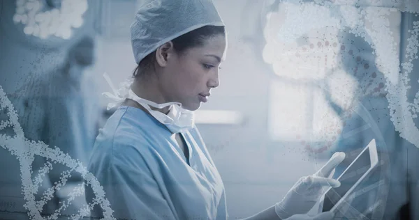 Female surgeon using digital tablet — Stock Photo, Image