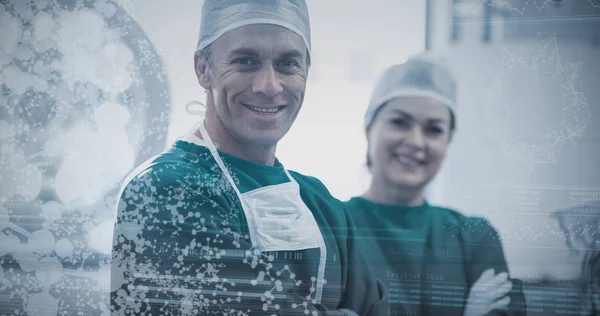 Surgeons standing with arms crossed — Stock Photo, Image