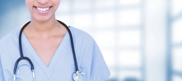 Female surgeon against dental equipment — Stock Photo, Image