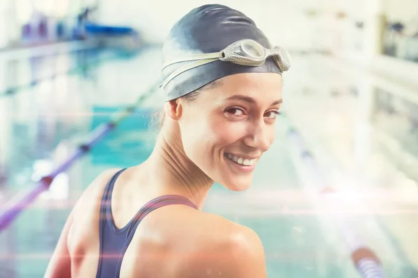 Pretty swimmer by the pool smiling — Stock Photo, Image