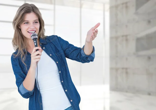 Woman speaking on microphone — Stock Photo, Image