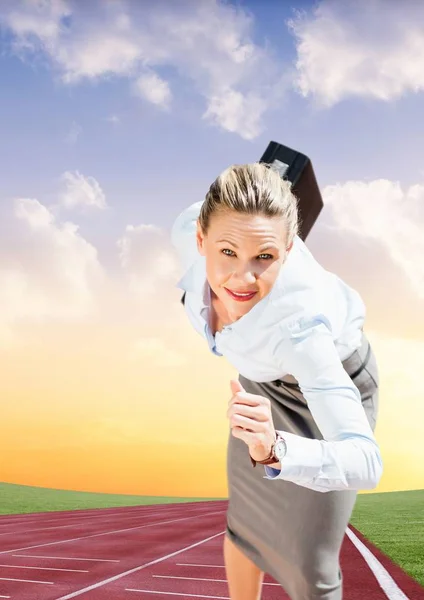 Businesswoman with briefcase running on race track — Stock Photo, Image