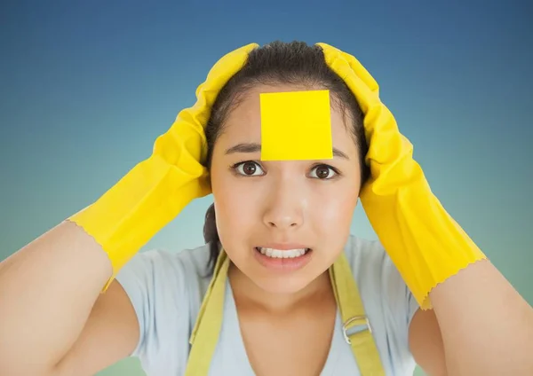 Stressed woman in rubber gloves with blank sticky note on her forehead — Stock Photo, Image