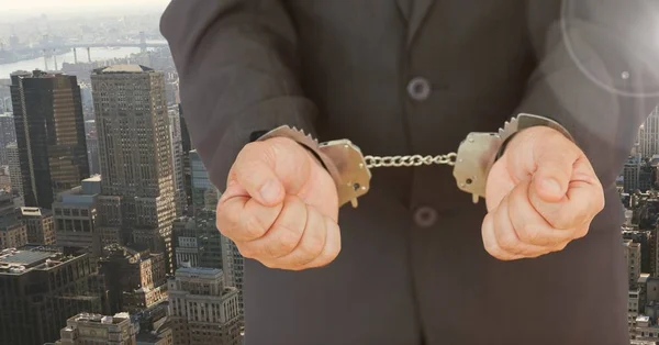 Businessman hands in handcuffs — Stock Photo, Image