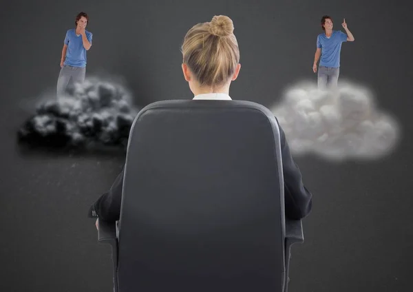 Businesswoman sitting on chair against man on clouds — Stock Photo, Image