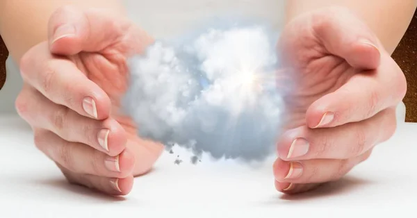 Hands protecting clouds — Stock Photo, Image