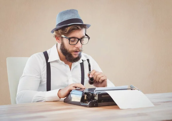 Man holding smoking pipe and using typewriter — Stock Photo, Image