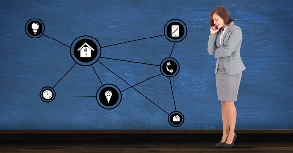 Businesswoman looking at connecting communication icons — Stock Photo, Image