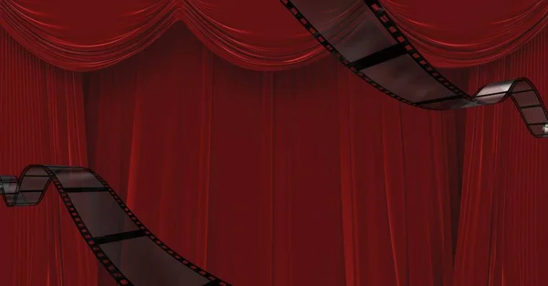 Film reels against red draped curtains — Stock Photo, Image