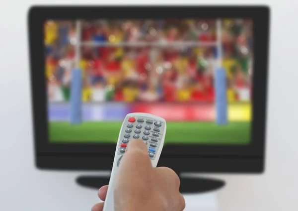 Man using remote control to change channels — Stock Photo, Image
