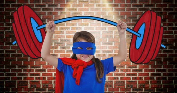 Girl in superhero costume pretending to lift weights against wooden background — Stock Photo, Image