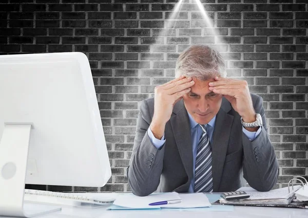 Stressed businessman sitting at computer desk — Stock Photo, Image