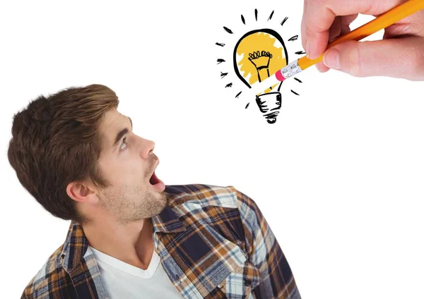 Shocked man looking at innovative bulb drawn — Stock Photo, Image