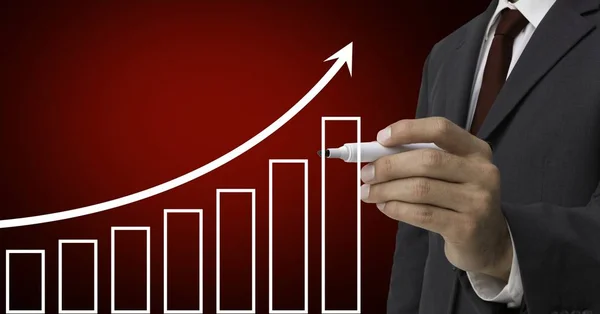 Businessman drawing upward trend graph with marker — Stock Photo, Image