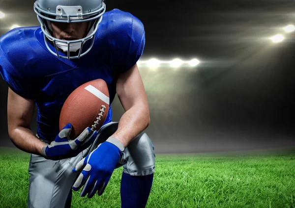 American football player holding rugby ball — Stock Photo, Image