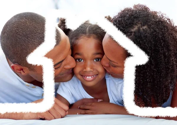 Parents kissing their daughter against house outline in background — Stock Photo, Image