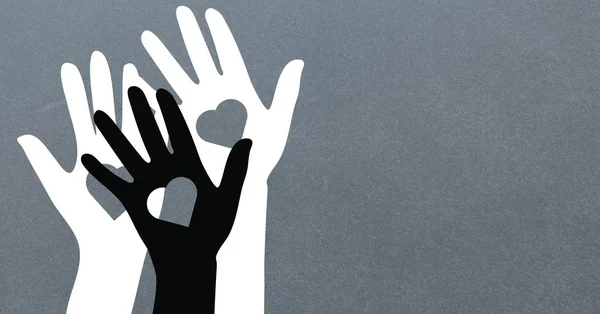 Manos blancas y negras con formas de corazón — Foto de Stock