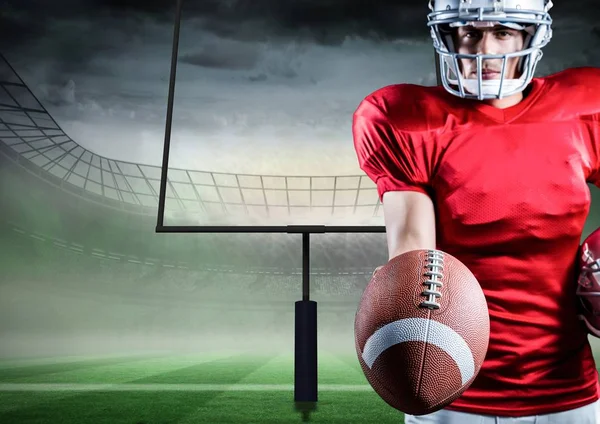 American football player holding rugby ball — Stock Photo, Image