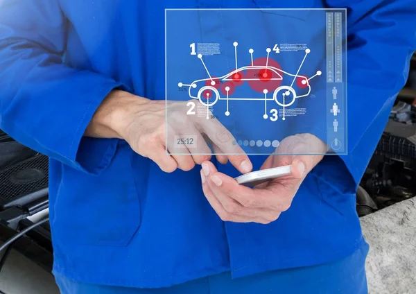 Mechanic using smartphone in garage — Stock Photo, Image