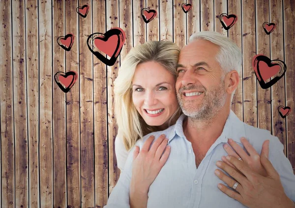 Mature romantic couple and heart graphic — Stock Photo, Image