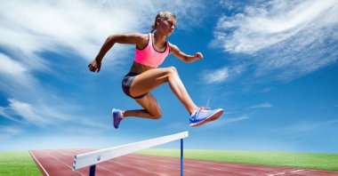 female athlete jumping above the hurdle clipart
