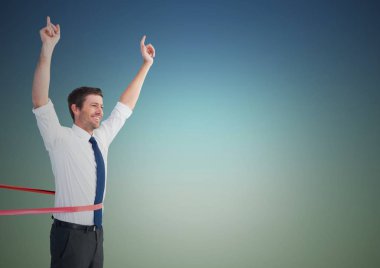 Businessman crossing finish line with arms up clipart