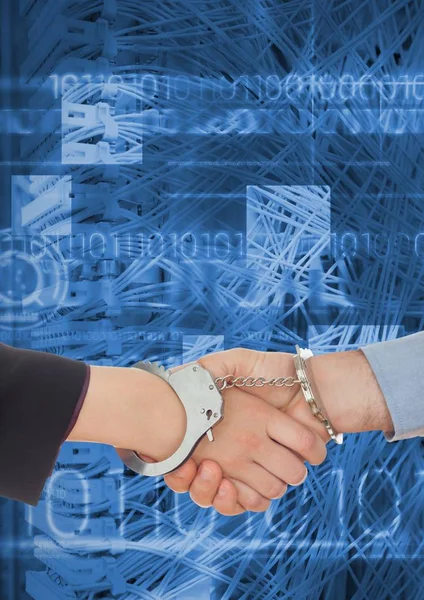 Business professionals shaking hands in handcuffs against coding background — Stock Photo, Image