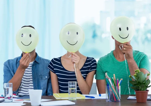 Colleagues holding smiley — Stock Photo, Image