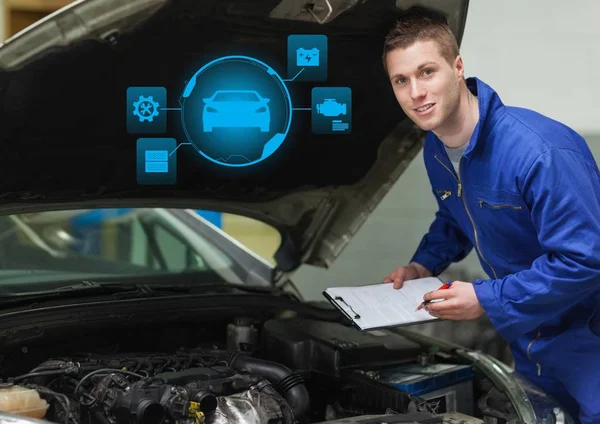 Mechanic man working on car and holding papers — Stock Photo, Image