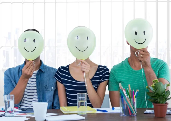 Colleagues holding smiley — Stock Photo, Image