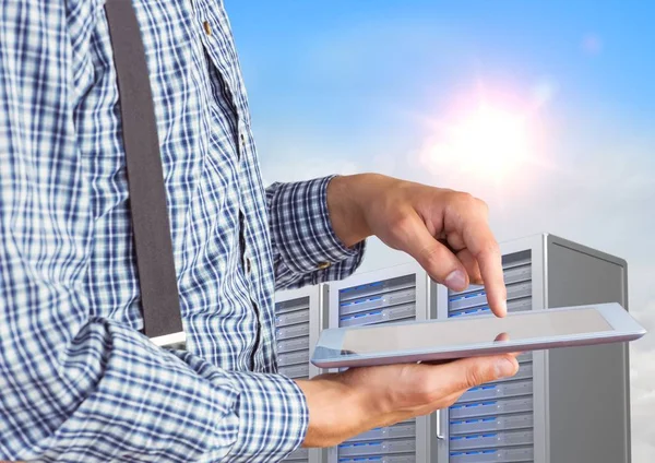 Man using digital tablet against office building in background — Stock Photo, Image