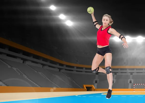 Female athlete playing handball in stadium — Stock Photo, Image