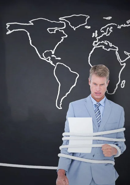 Businessman tied up in rope against world map — Stock Photo, Image