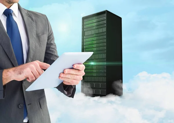 Businessman using digital tablet against background with server building in sky — Stock Photo, Image