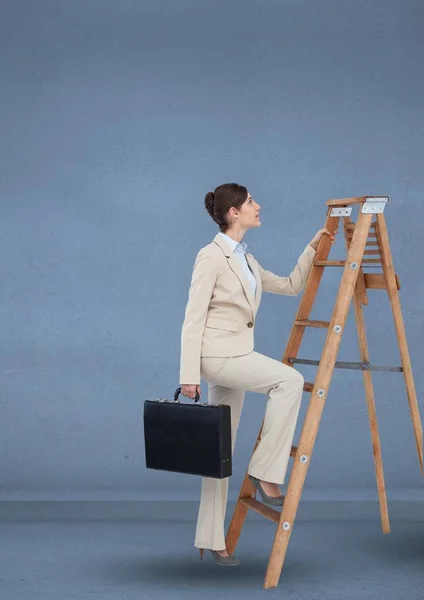 Businesswoman with briefcase climbing on step ladder — Stock Photo, Image