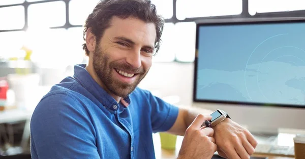 Smiling man using smart watch — Stock Photo, Image