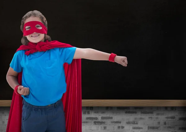 Portrait of smiling super kid in red cape and red mask — Stock Photo, Image