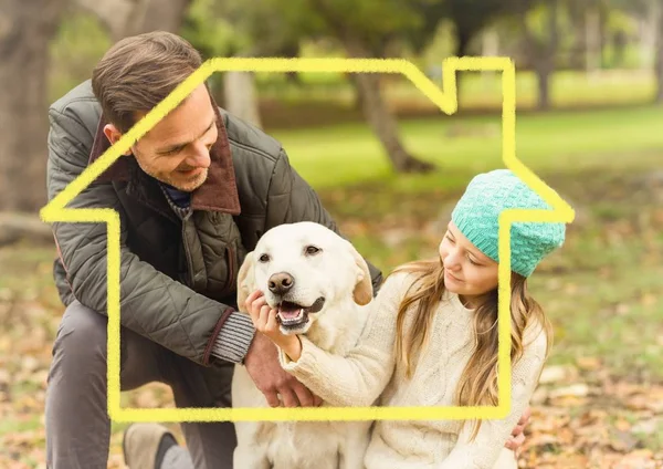 Father and daughter playing with dog — Stock Photo, Image