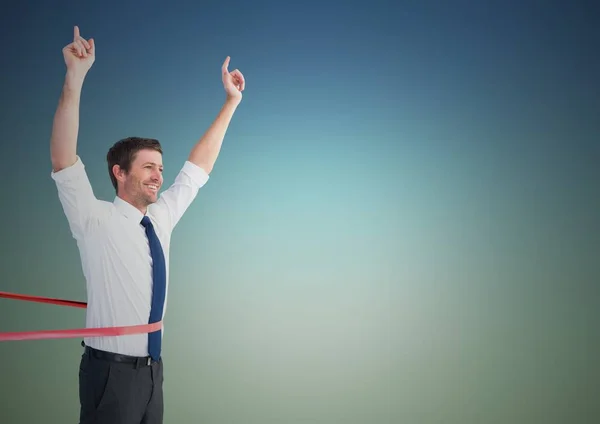 Businessman crossing finish line with arms up — Stock Photo, Image