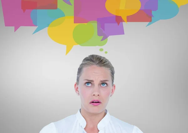 Confused woman with speech bubbles — Stock Photo, Image