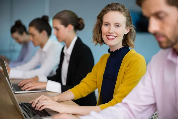 Business executives using electronic devices — Stock Photo, Image