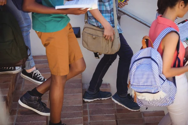 Students moving down staircase — Stock Photo, Image