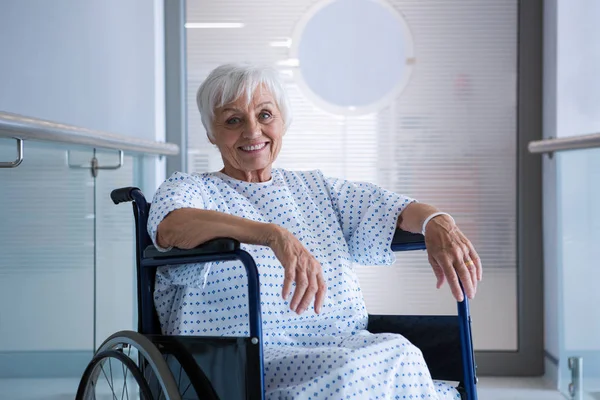 Disabled senior patient on wheelchair in hospital — Stock Photo, Image