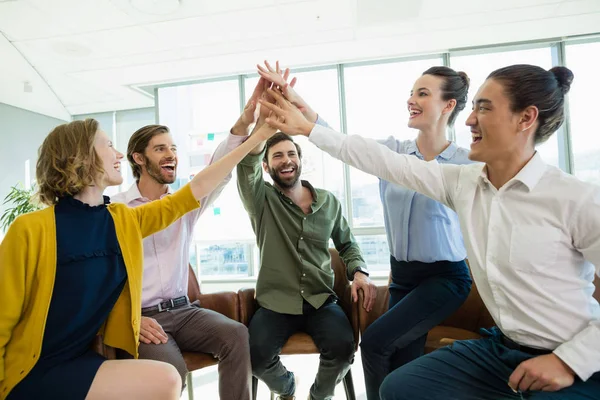 Business executives giving high five to each other — Stock Photo, Image