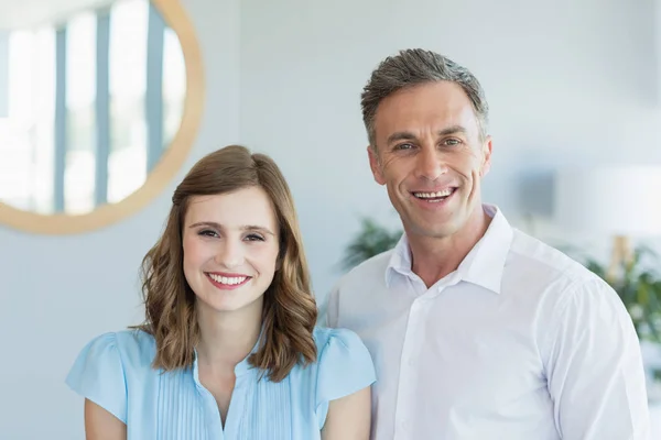 Business executives smiling while in office — Stock Photo, Image