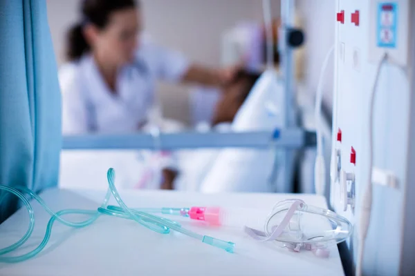 Close-up of iv pipe on table — Stock Photo, Image