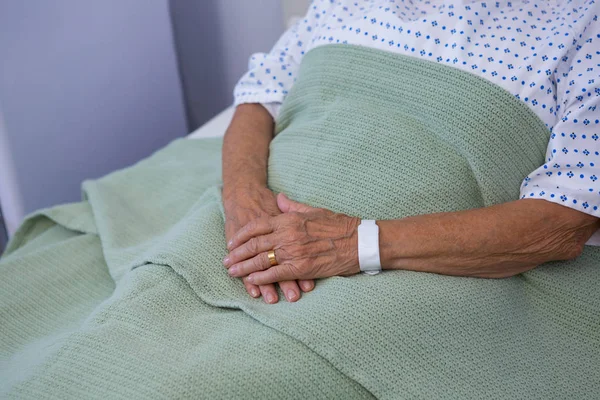 Senior patient relaxing on bed — Stock Photo, Image